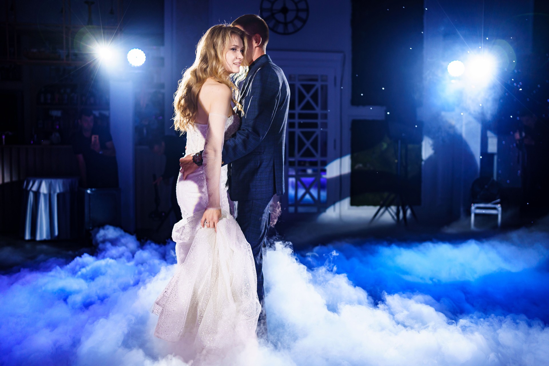 Beautiful and happy bride and groom dancing first dance at wedding.